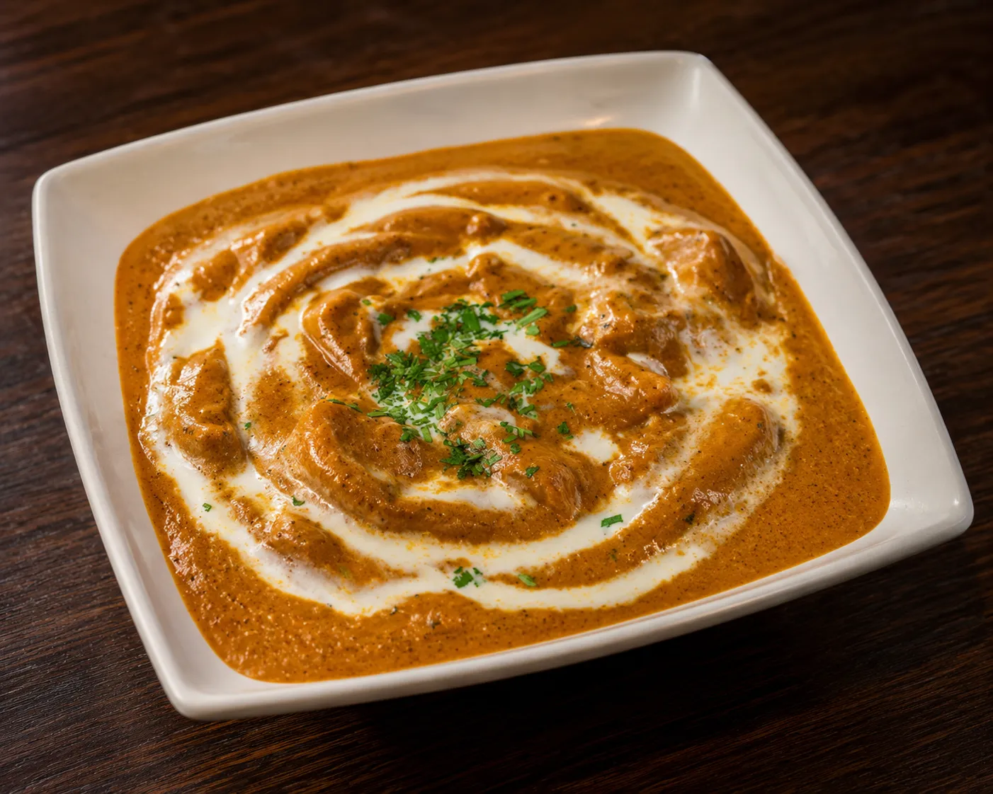 Kadai fish curry cooked with bell peppers and freshly ground spices at Tamarind East Indian Restaurant Calgary