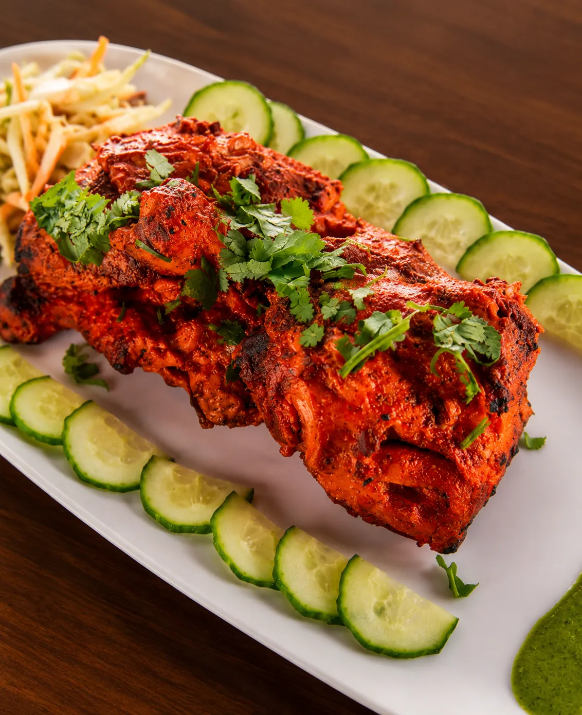 Tandoori chicken grilled in the clay oven at Tamarind East Indian Restaurant in Panorama Hills Calgary